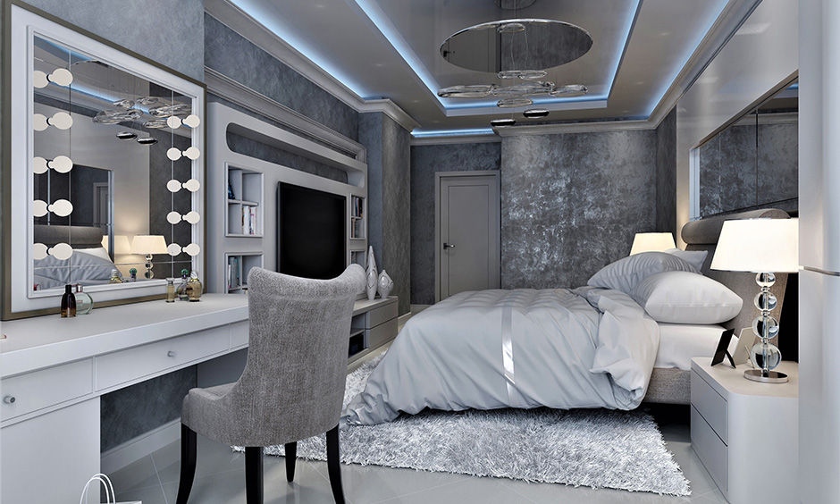 Stylish modern dressing table design with vanity mirror lights adds a touch of glam to the bedroom
