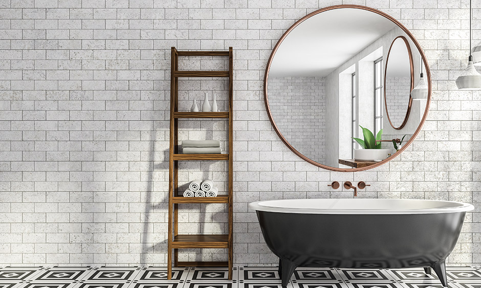 Classic black and white bathroom features geometric printed tiles on floor and subway tiling on wall