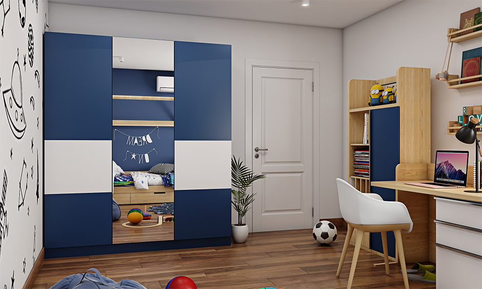 Kids' bedroom blue and white wardrobe design with a full-length mirror on one of the doors lend a dreamy vibe