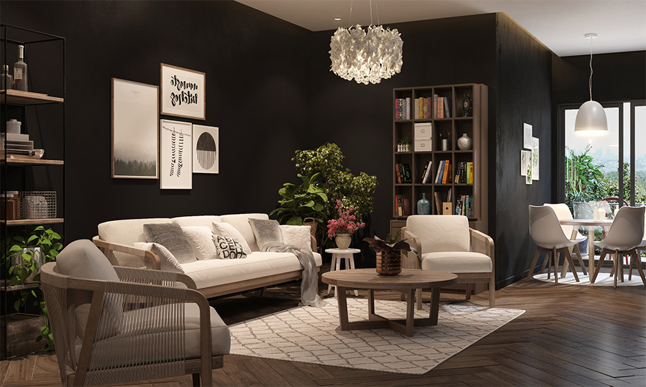 Bold matte black wall paint in the living room with a laminated wooden floor creates the perfect balance