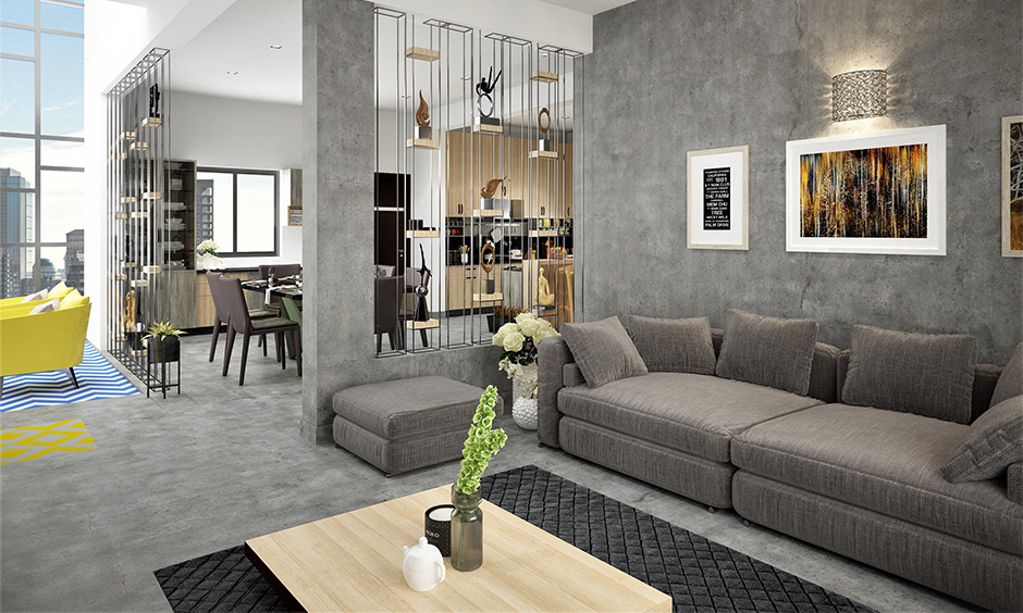 A grey living room color with a grey couch and charcoal grey carpet create visual contrast