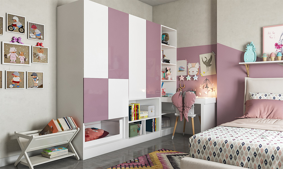 A light purple and white wardrobe design attached to the study unit makes optimum use of the space