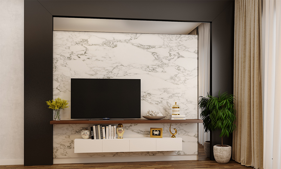 Wall-mounted tv unit design for living room against marble panel blends in effortlessly with the mirror panel