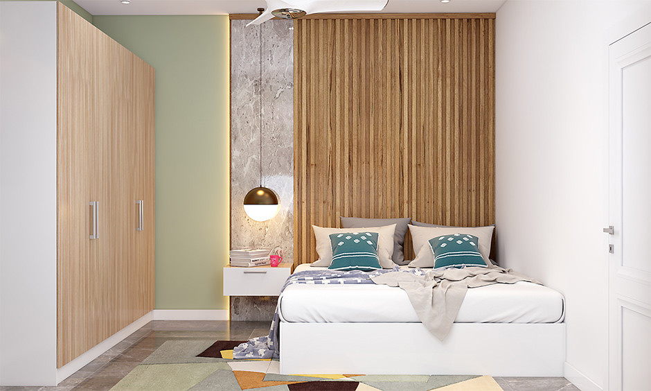 12x15 bedroom design with light wood finish laminate on the wall brings a sense of warmth to the space