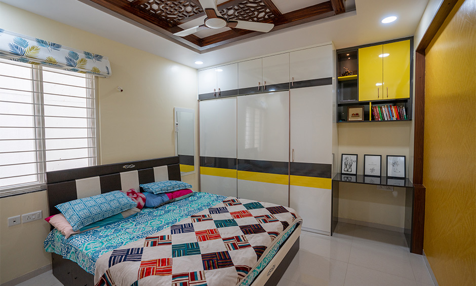 A master bedroom with a gorgeous floor-to-ceiling wardrobe by top interior designers in hyderabad