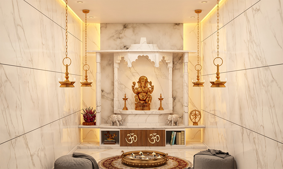 An all-marble pooja room tiles design with backlights highlights and brightens up the space