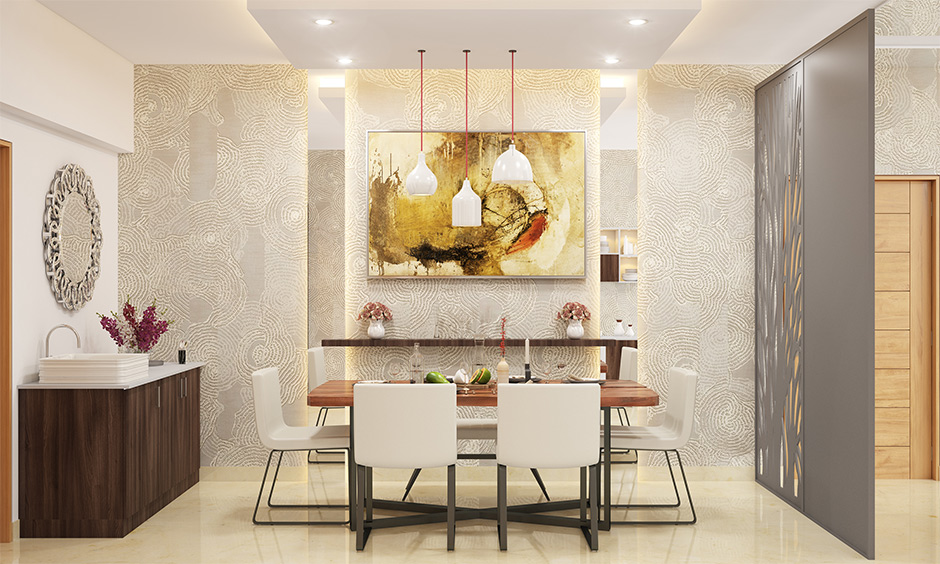 The dining room with Indian contemporary home interiors completes the look