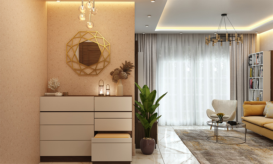 Indian contemporary home interiors for your foyer with a sleek cabinet with handleless drawers look clutter-free