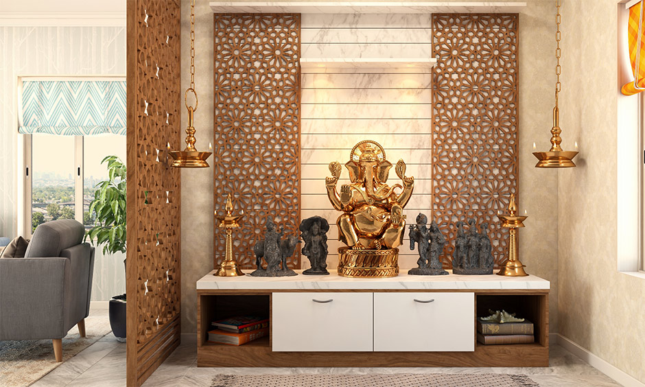 A modern pooja room with marble tiles paired with intricate carvings accentuates its beauty