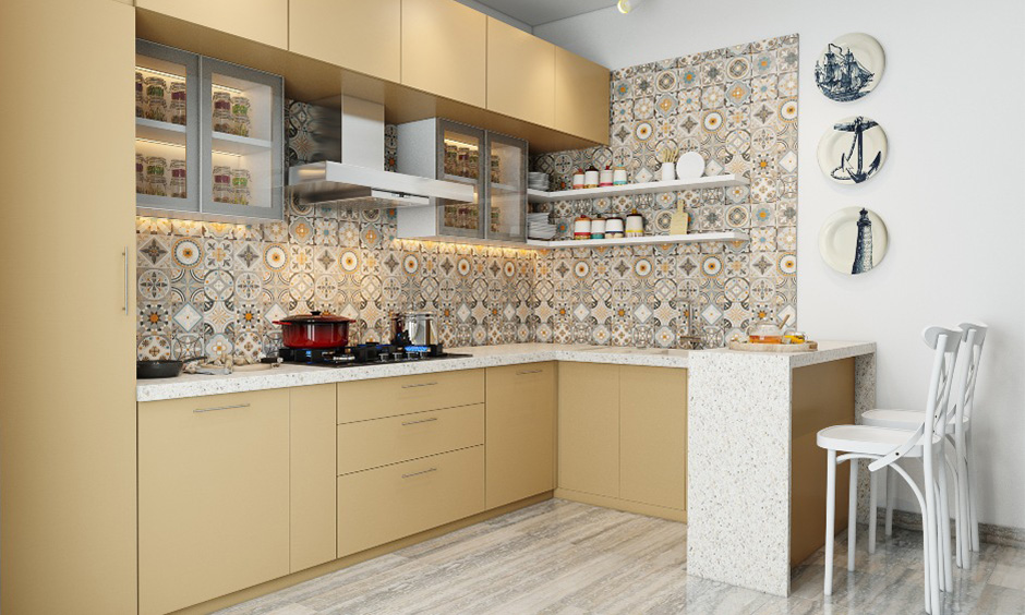 A Spanish style kitchen backsplash in Morrocan tiles design gives an old Spanish style home