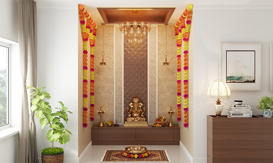 Vitrified tiles for pooja room with the wooden false ceiling with an intricate chandelier illuminate the room