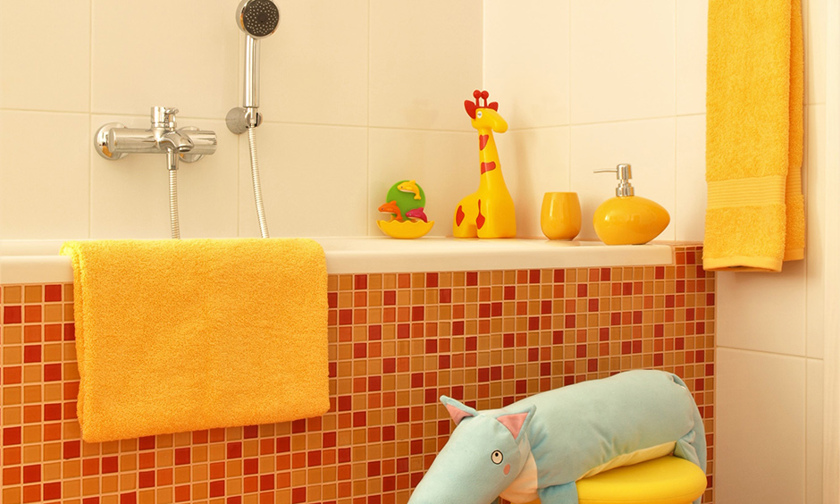 Mosaic tiles in different shades of an orange and yellow bathroom are ideal for your kid's bathroom