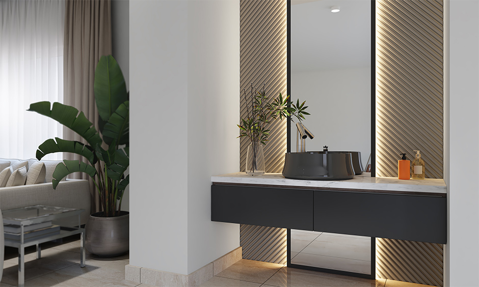 A backlit rectangle mirror design in the living room with a washbasin creates a stunning nook