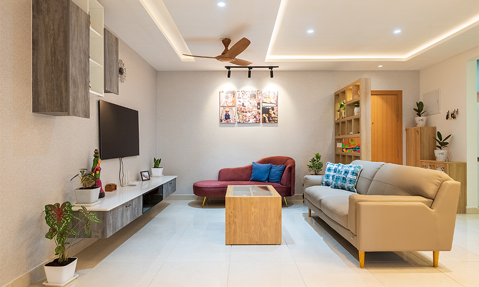 A happy family living room with storage partition for toys and showpieces