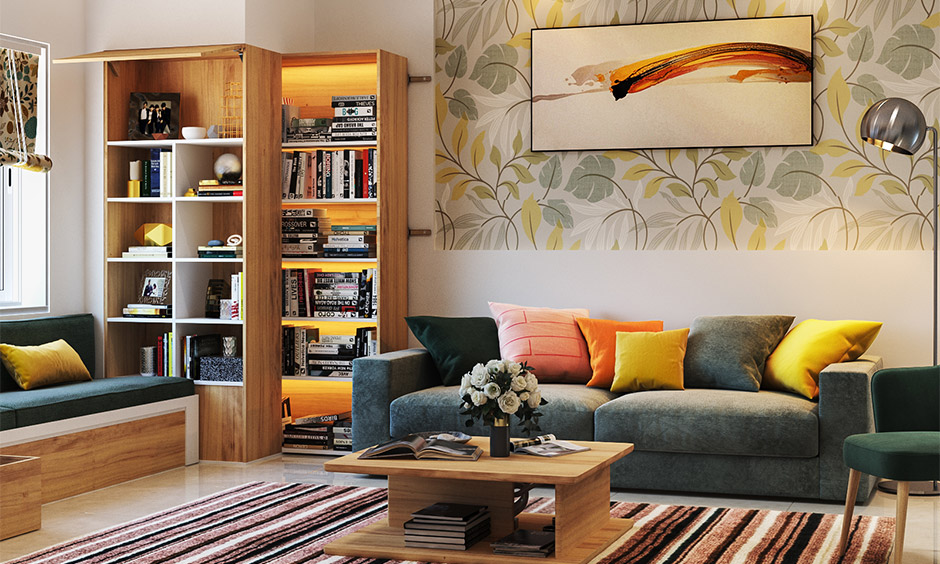 A modern eclectic living room with a small library and wall portrait