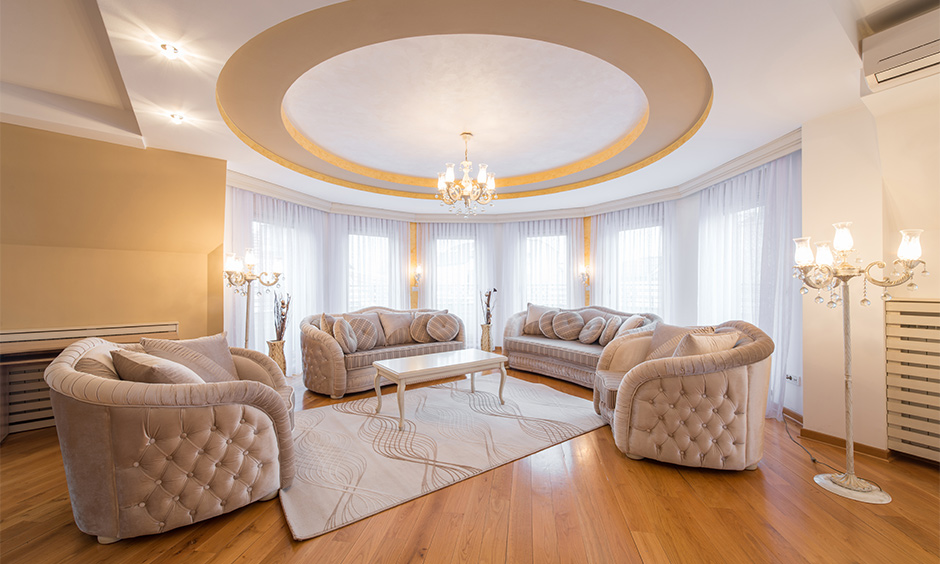 Diamond tufted sofas in vintage style cast a traditional glow in the living room