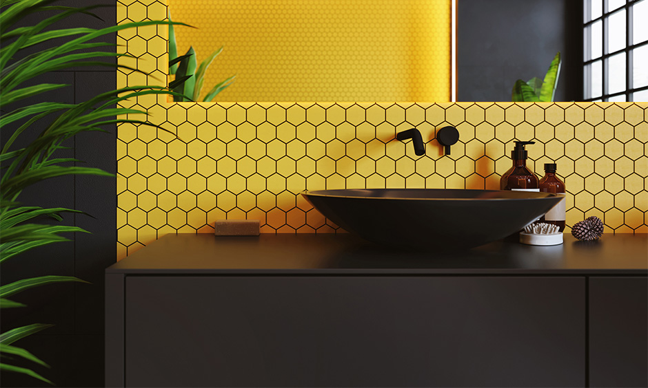 Black bathroom sink in elegant appeal with yellow tile wall and mirror