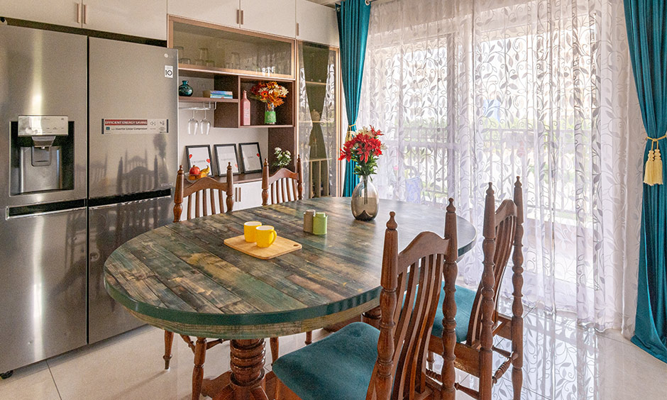 Low-cost interior designers in Hyderabad designed a family dining room in a blue and brown theme