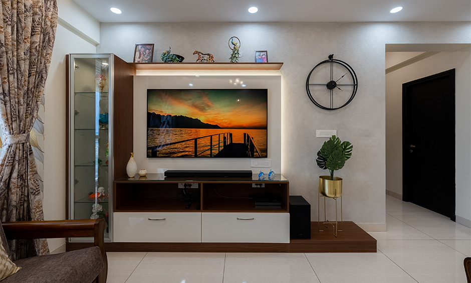 Family living room room with a glass cabinet to showcase your love for art 