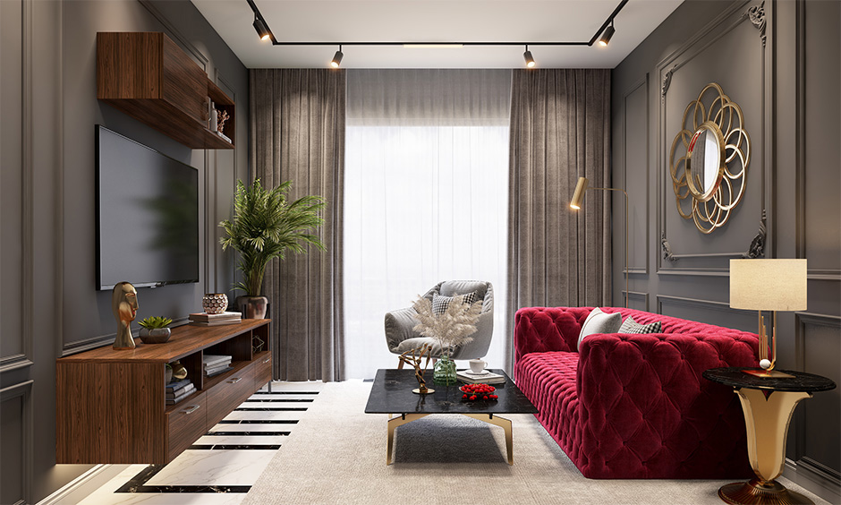 A glamorous large tufted sofa in red velvet paired it with cushions