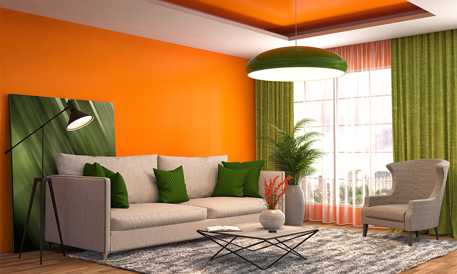 Green curtain for orange wall is ideal for living room with different aesthetic features
