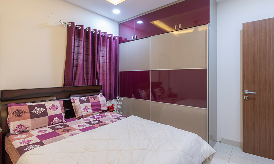 3bhk home interior designer in Kondapur Hyderabad designed a guest bedroom with a wardrobe with sliding doors is clutter-free