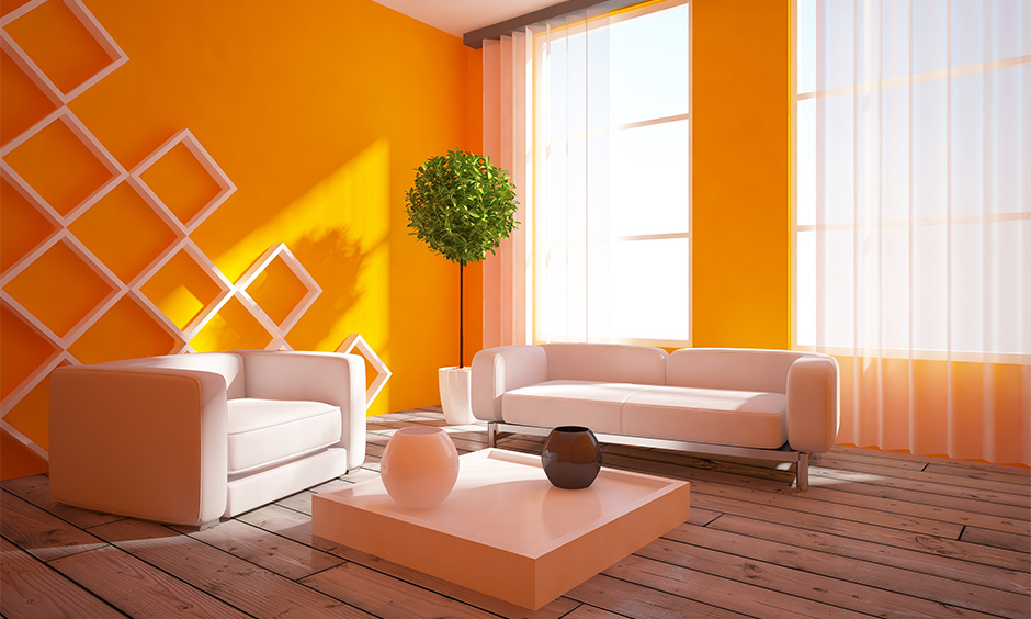 The sheer white latest curtain for the orange wall creates a contrast that highlights the wall colour