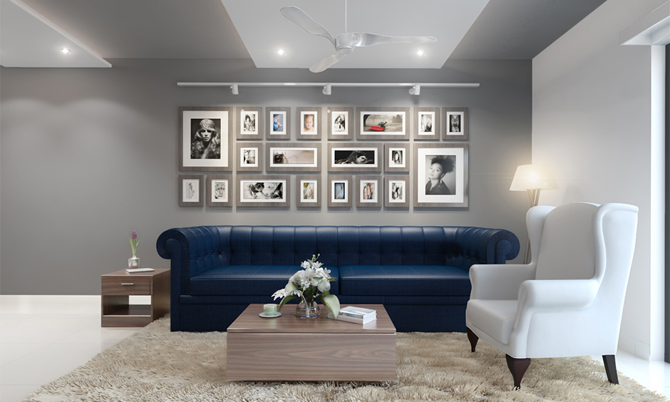 Living room sofa in a blue and white living room with single and multi-seater sofas adhere to the tone