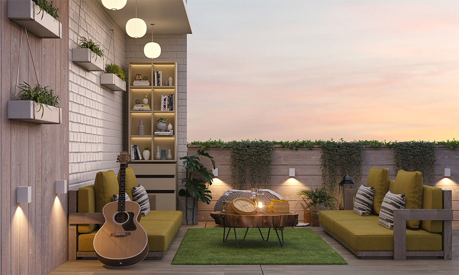 Outdoor patio design comes with floor-level sofas, hanging plants, and decorative lights