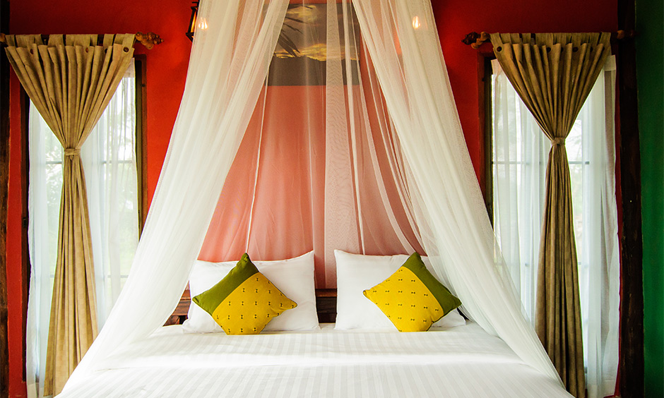Sheer white and coffee curtain color combination for the orange wall is a subtle charm