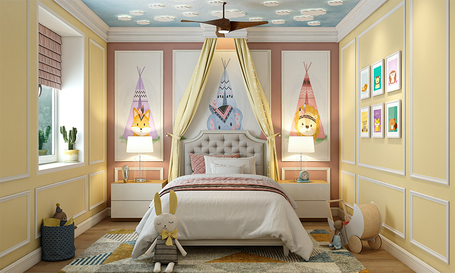 A gallery wall brings symmetrical balance to interior design through art in the kid's bedroom