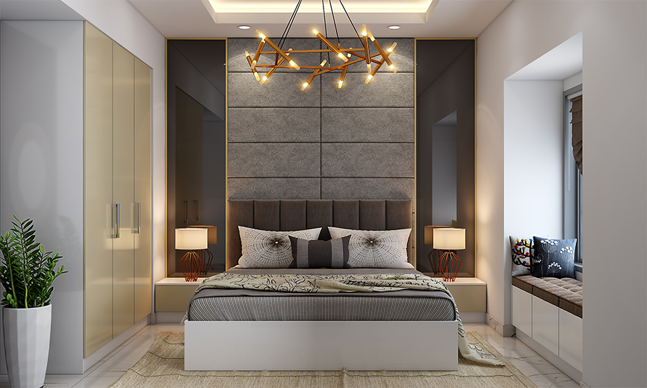 Symmetrical balance in bedroom interior design with extended headboard with tinted glass panelling on both sides