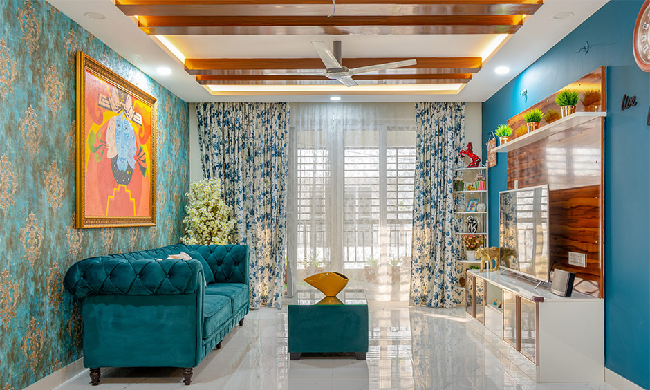 Top interior designers in Osman Nagar Hyderabad designed this 3bhk living room with a modular TV unit and chesterfield sofa