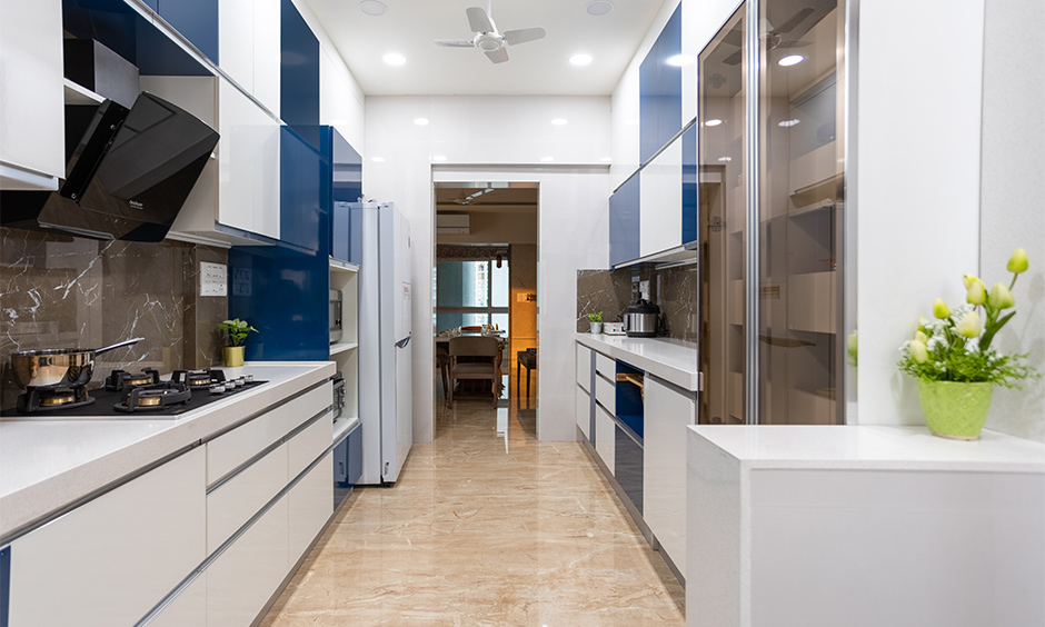 3bhk interior designer in Mulund, Mumbai, designed a parallel kitchen with modern laminate cabinets