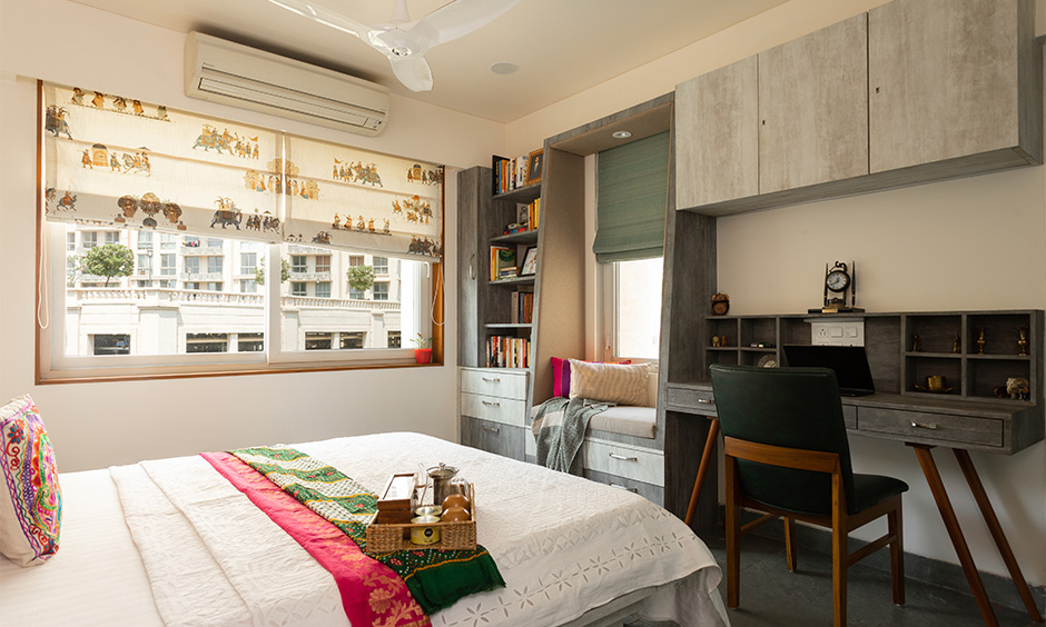 A study table with the bookshelf in the bedroom with a window bay seater attached where you can enjoy your tea breaks