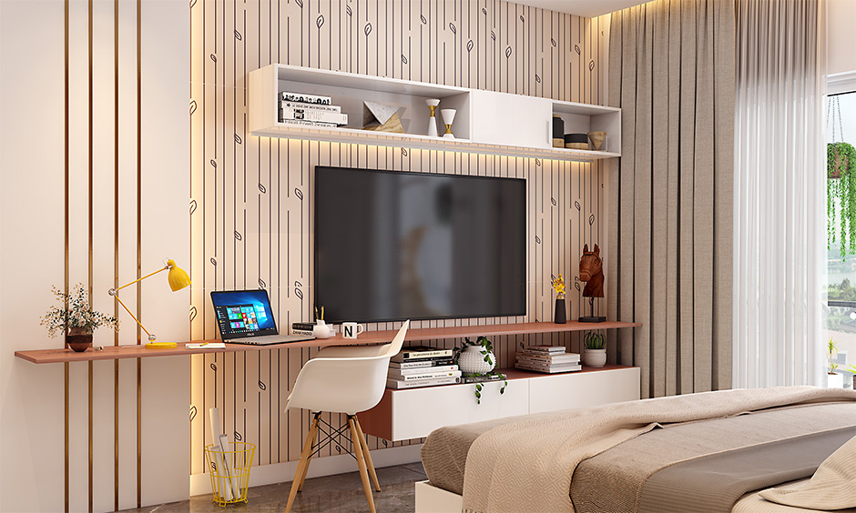 Bedroom tv unit with study table and cabinet beneath lends arrange your books and files clutter-free