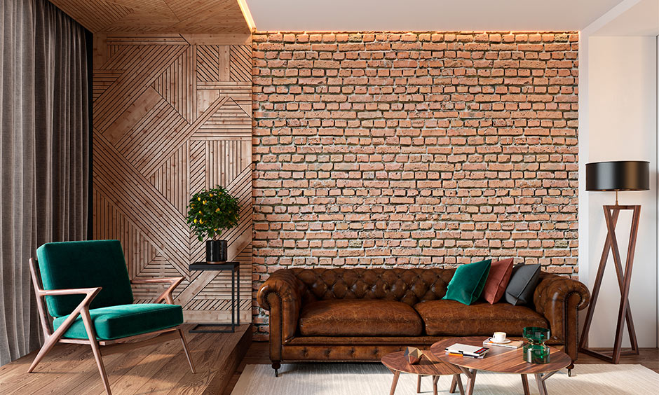 A living room brick wall design with authentic industrial charm creates a dramatic aura