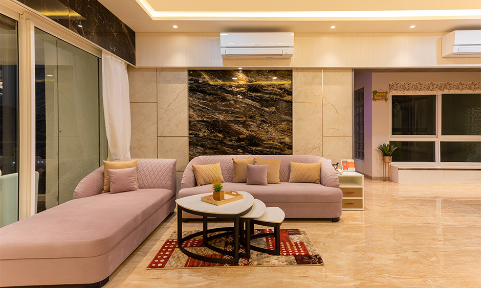 A famous interior designer in Mulund, Mumbai, designed a 3bhk living room with a chaise lounge