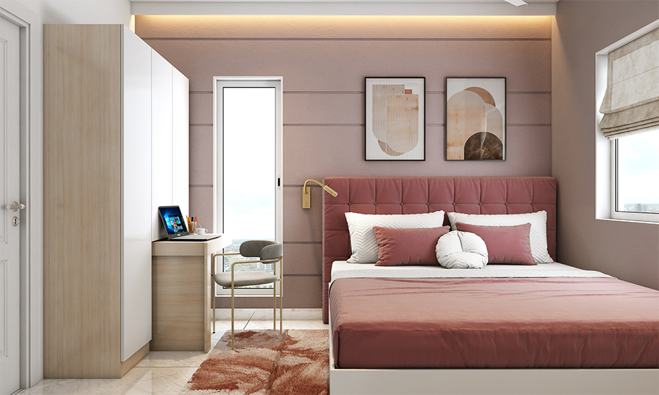 Wardrobe design for bedroom with pull-out study table attached provides an ergonomic working area