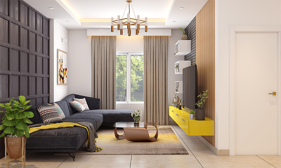 Dark grey velvet sofa in living room looks joyful and jazzy