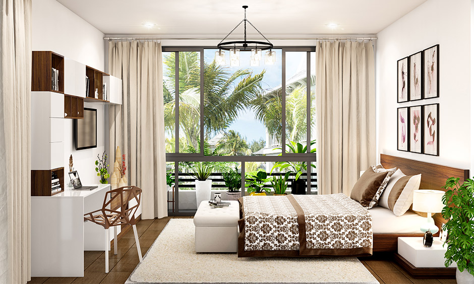 Modern Mediterranean bedroom with a large window and potted plants lends mesmerizing coastal views