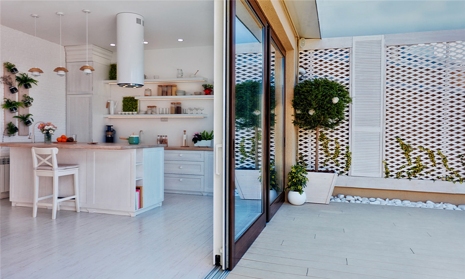 Modern semi-open kitchen with sliding glass door restricts direct access