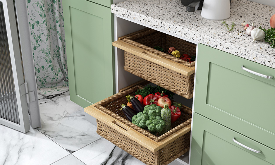 Open kitchen cabinets with wicker baskets used for storing vegetables and fruits