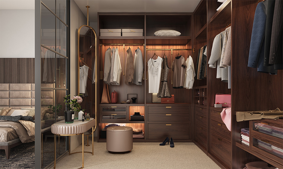 An elegant leather pouffe as a vanity chair in a walk-in-closet