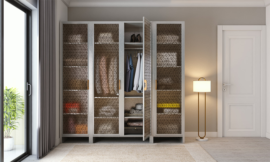 Iron wardrobe design with patterned glass doors makes every guest envious