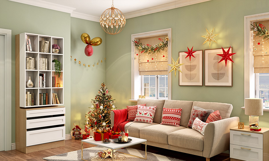 Decorate living room with red and gold Christmas tree in the corner and Christmas-themed accessories