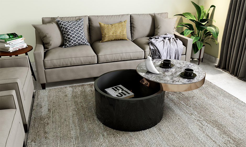 Round marble coffee table with rose gold lift-top feature