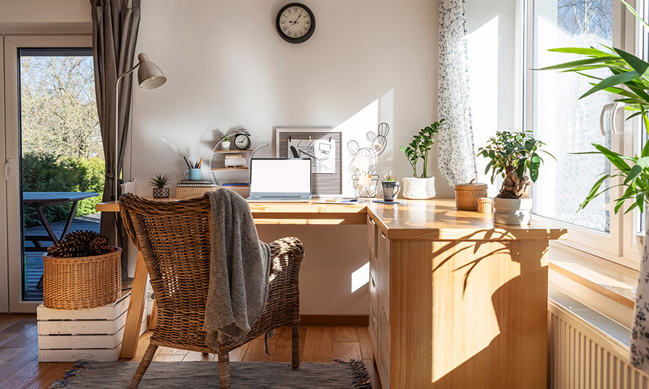 Rustic wooden desk chair with sloped armrests is comfy and adds warmth to space