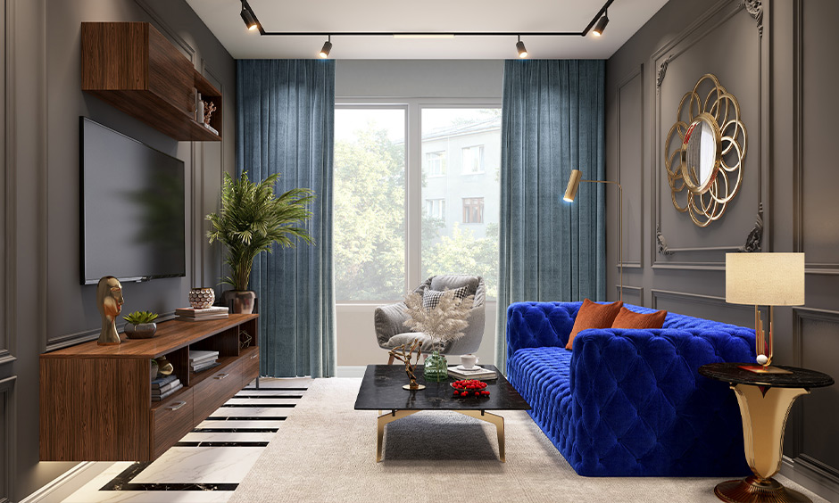 Royal blue sofa against a grey wall for a living room