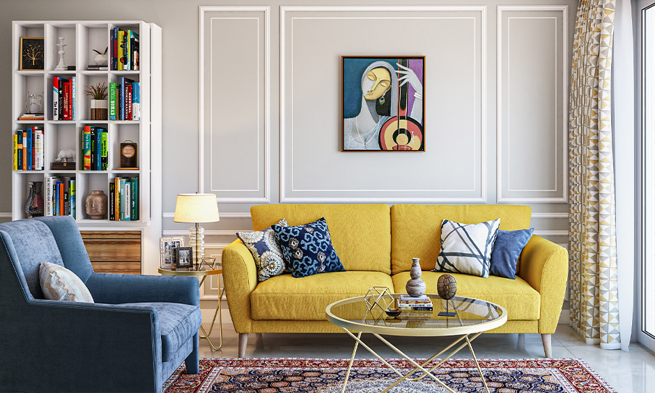 A round center table with glass top and styled metal legs in gold